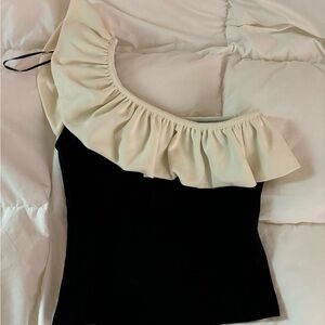 Elegant Black and Cream One-Shoulder Top